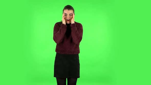 Woman Suffering From Headache From Fatigue. Green Screen