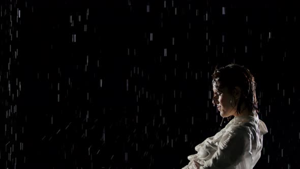 Beautiful Woman Dancing In The Rain