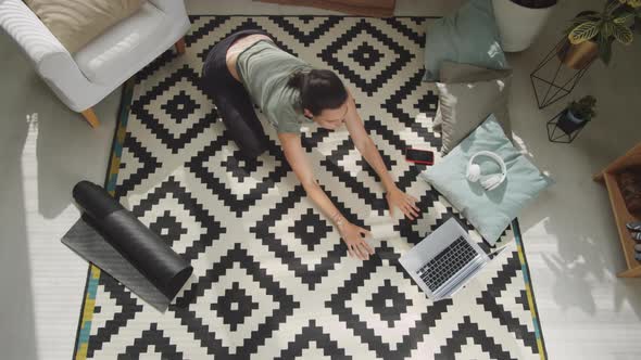 Top Down of Woman Doing Yoga at Home