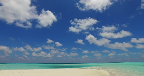 Tropical aerial abstract shot of a white paradise beach and blue water background in colorful 