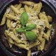 Pasta with Parmesan Cheese and Creamy Pesto Sauce in Black Bowl - VideoHive Item for Sale