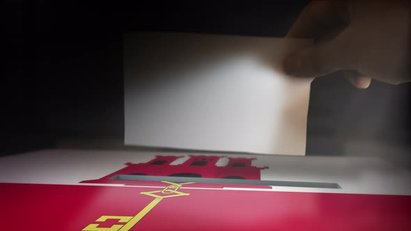 Digital Composite Hand Voting To National Flag OF Gibraltar alt