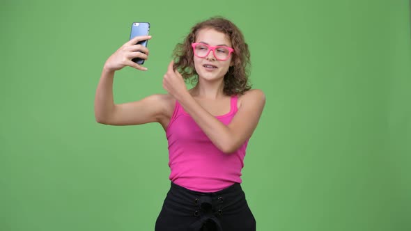 Young Happy Beautiful Nerd Woman Taking Selfie