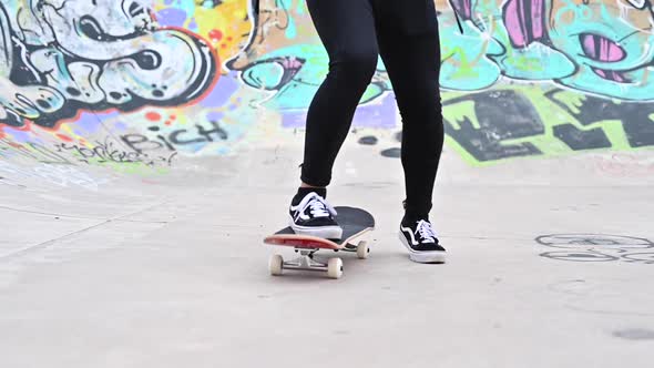 Close Up of Young Man Riding a Skateboard at the Skate Park.