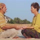 Senior Couple Sits and Meditating Together on Sandy Beach - VideoHive Item for Sale