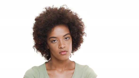 Displeased Young Beautiful African Girl Over White Background
