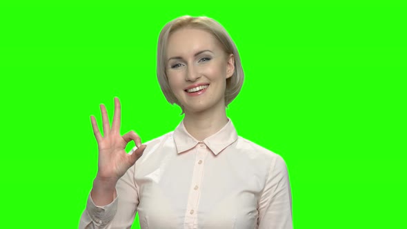 Portrait of Happy Mature Blond Woman with Ok Sign