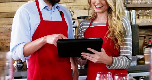 Waiter and waitress using digital tablet