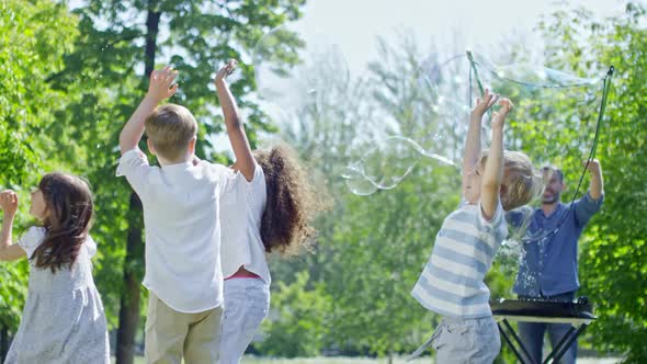 Kids at Soap Bubbles Party in Park