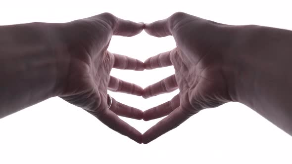 Person does hand gesture with bright white backdrop 34