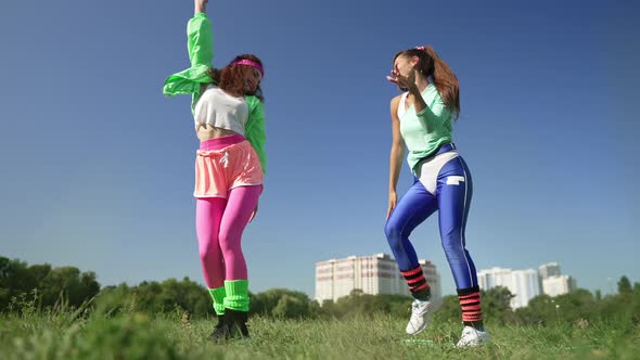 Two Happy Friends Dancing Having Fun in Sunshine Outdoors in 1990s