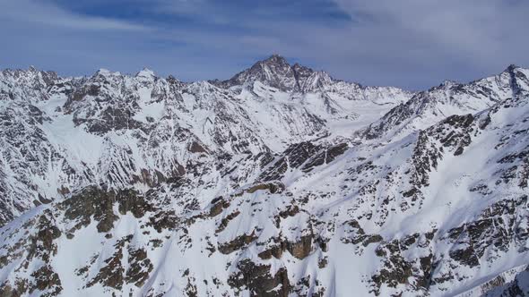 Winter drone flight over Mestia`s mountains in gerorgia. Tetnuldi Ski Resort next to Uschba and Tet