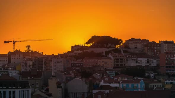 Sunrise over Lisbon aerial cityscape skyline timelapse from viewpoint of St. Peter of Alcantara