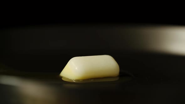 TIME-LAPSE: Cube Of Butter Melts On Hot Pan - Close Up