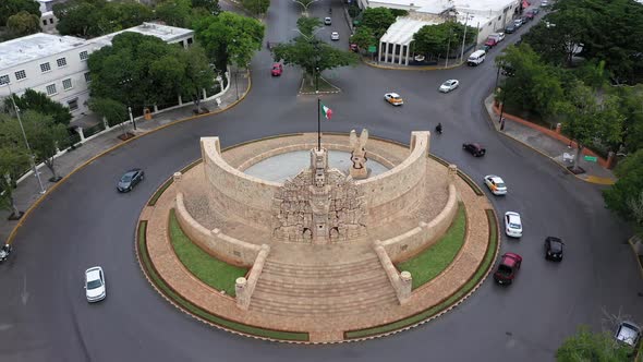 Aerial pull back from the Monument a la Patria, Homeland Monument on the Paseo de Montejo in Merida,