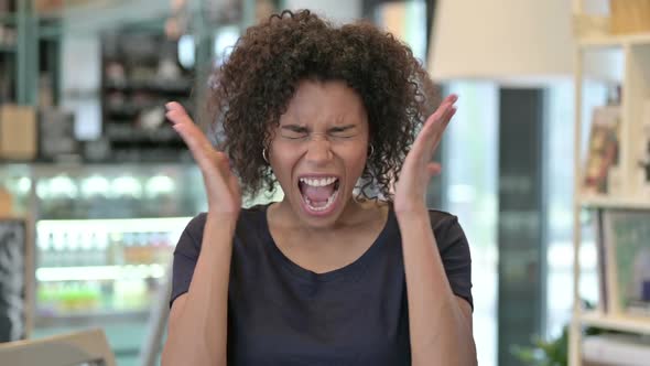 Portrait of Angry Young African Woman Shouting Screaming