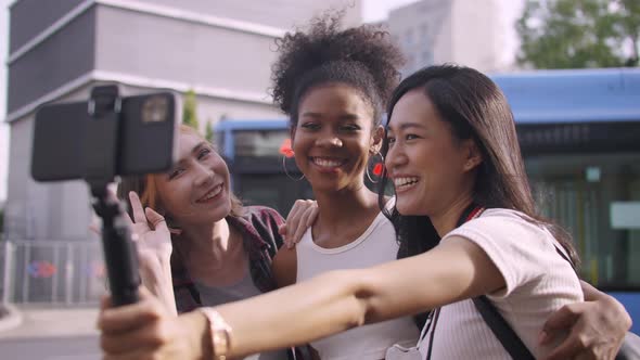 Young tourists having fun taking pictures together.