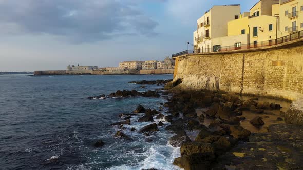 View of the Embankment of the Island of Ortigia During Sunrise. Bird's Eye View. Sicily. Italy