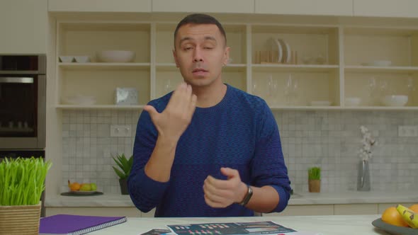 Positive Male with Hearing Loss Talking with Sign Language During Video Call