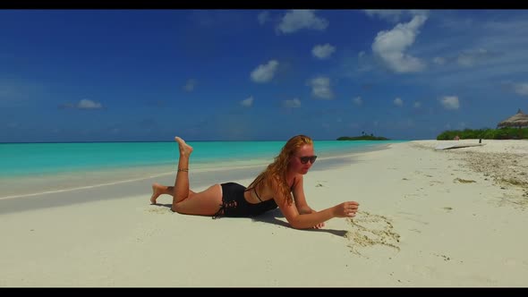 Women posing on exotic sea view beach wildlife by aqua blue ocean and white sandy background of the 