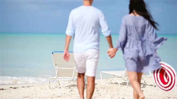 Young Family on White Beach During Summer Vacation