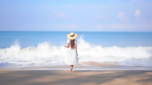 Asian woman enjoy around beautiful beach sea ocean