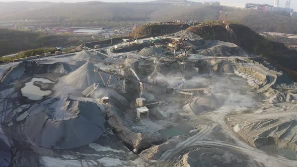 Big Crusher Working with Rubble at a Quarry Moving It on a Line