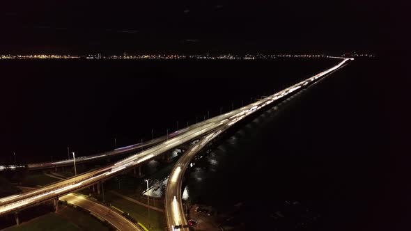 Drone shot car light trail at Penang Bridge cross sea