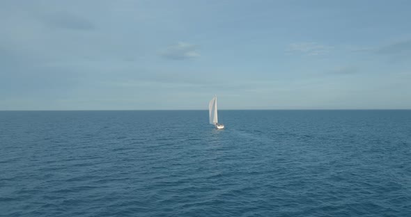 Sun Yachts with White Sails in Open Sea Aerial