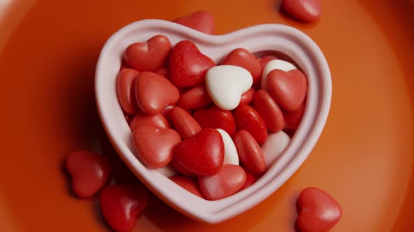 Rotating stock footage shot of Valentines decorations and candies - VALENTINES 0075
