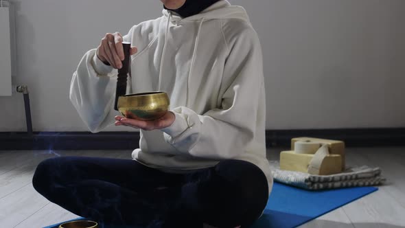 A Young Woman in Hijab Does Meditation Ritual