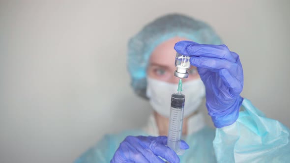  Nurse picks medicine into a syringe