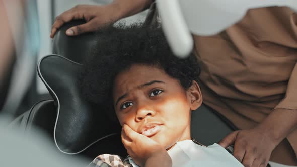 Black Boy in Dentist Chair Talking