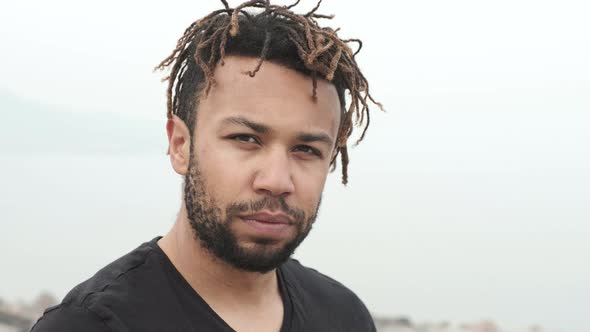 Sporty  Mixed Race Man Looking Serious at Camera.