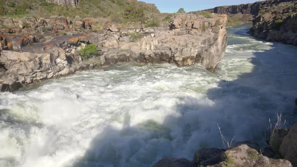 Panning view of the Snake River with shadow of person on the river