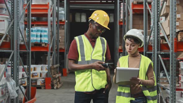 Warehouse Workers Talking and Posing