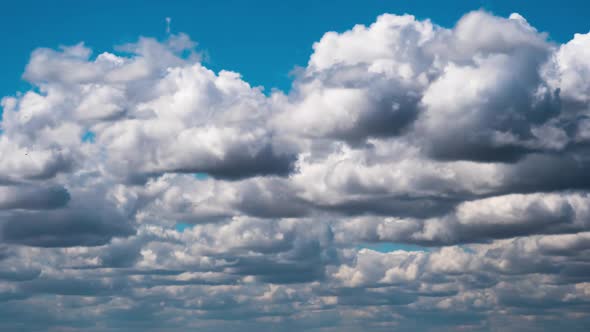 Cumulus Cirrus Clouds Move in the Blue Sky. Time Lapse.