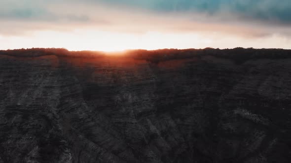 The drone rised above the canyon and captured the wonderful sunset in Waimea Canyon, Kauai, Hawaii