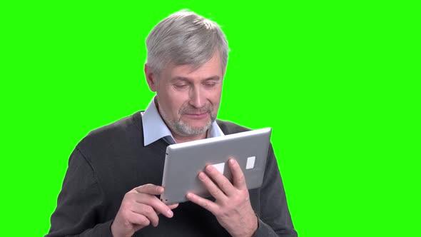 Portrait of Handsome Man Using Digital Tablet