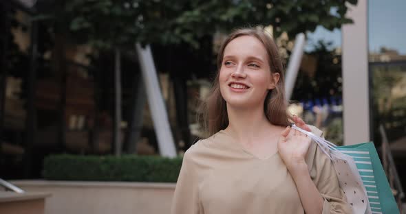 Close Up View of Young Pretty Girl Looking Aside and Smiling, Beautiful Millennial Woman Carrying