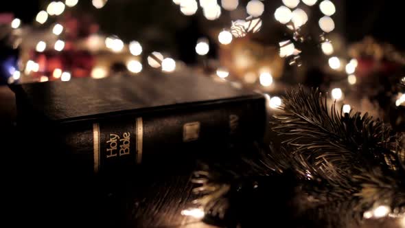 Bible With Bokeh Lights In Christmas