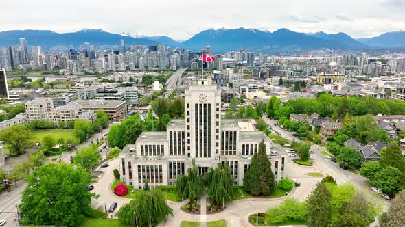 Fly Over Vancouver City Hall With Canadian Flag In Vancouver, British Columbia, Canada. Aerial Drone