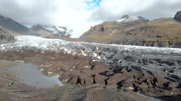 Cinematic panning shot close to the front of a glacier.