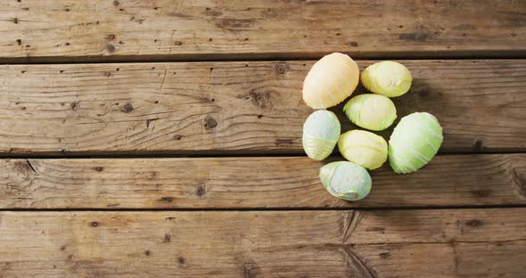 Video of decorated colorful easter eggs on a wooden surface