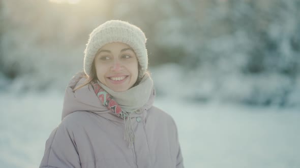 Slow Motion Cheerful Beautiful Woman Walking in Winter Park After Snowfall