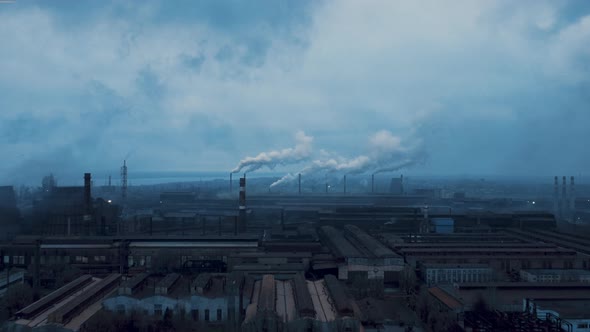 view on pipes with smoke. smoke from the chimney. heavy industry with air pollution produced smoke