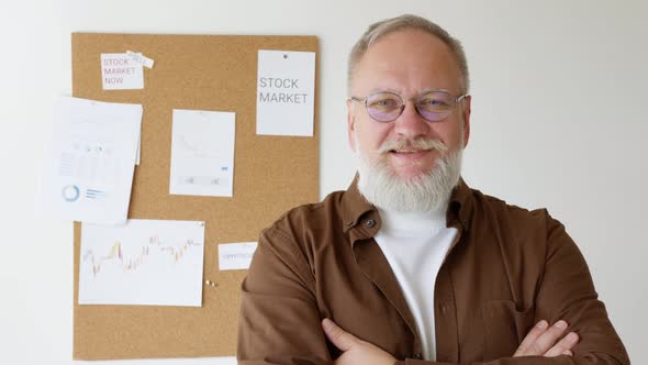 portrait man with glasses smiling