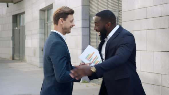 Businessmen Meeting at City Street. Partners Greeting Each Other Outdoors