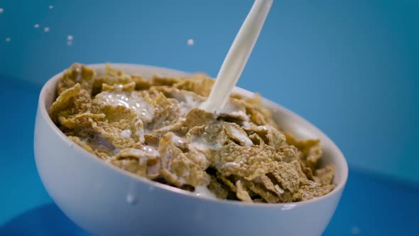 Pouring Milk In Corn Flakes Cereal