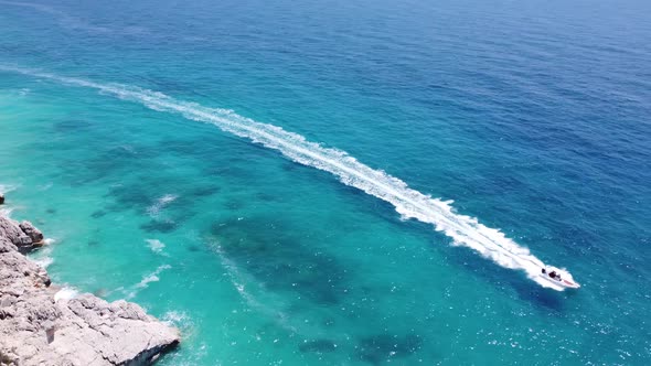 Drone View of a Boat the Blue Clear Waters